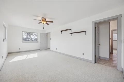 a view of balcony with wooden floor