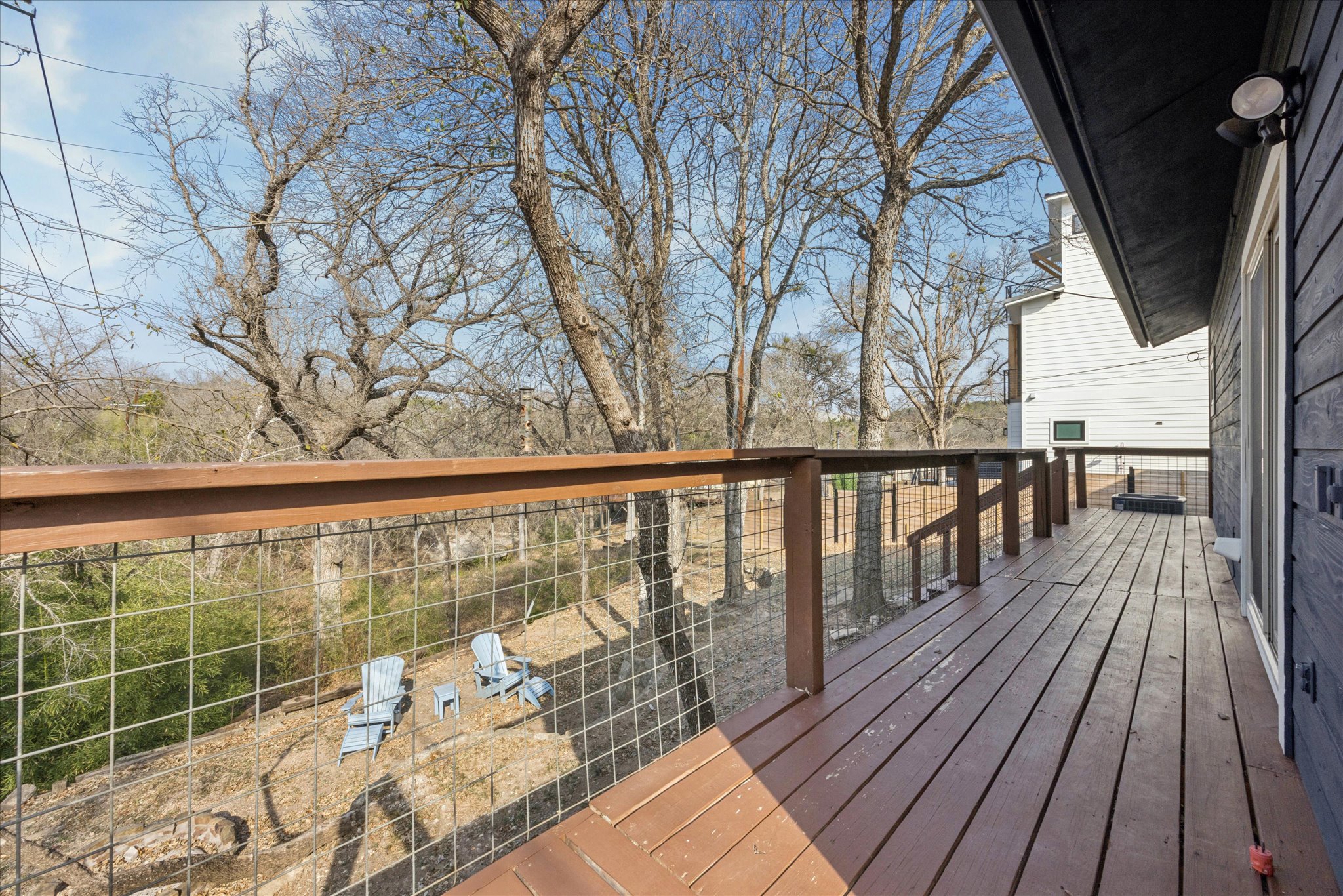 13918 Hummingbird Lane Austin, TX 78732 - Photo 23 of 32 a view of balcony with wooden floor and fence