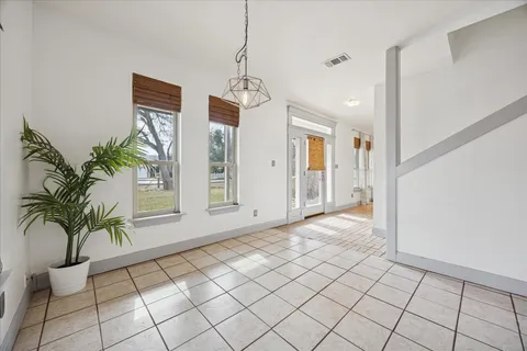 a kitchen with a sink refrigerator and cabinets