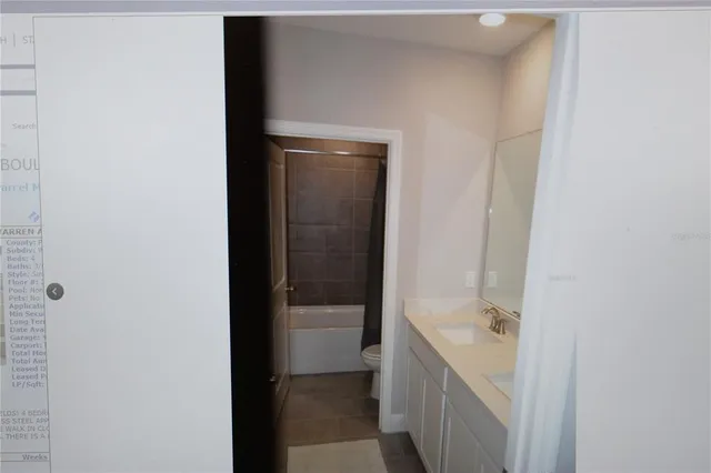 a bathroom with a sink and mirror