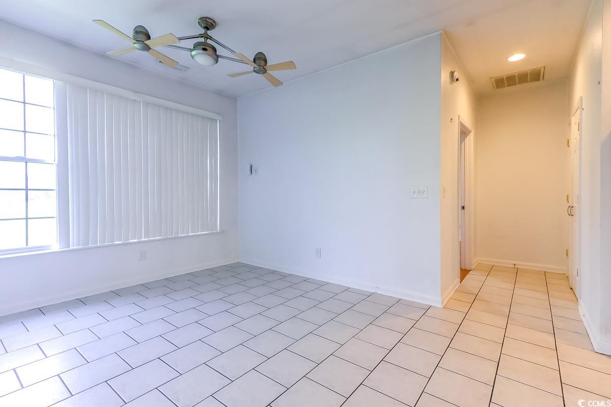 2191 Jasmine Road Loris, SC 29569 - Photo 11 of 40 Unfurnished room with ceiling fan, light tile patterned flooring, baseboards, and recessed lighting