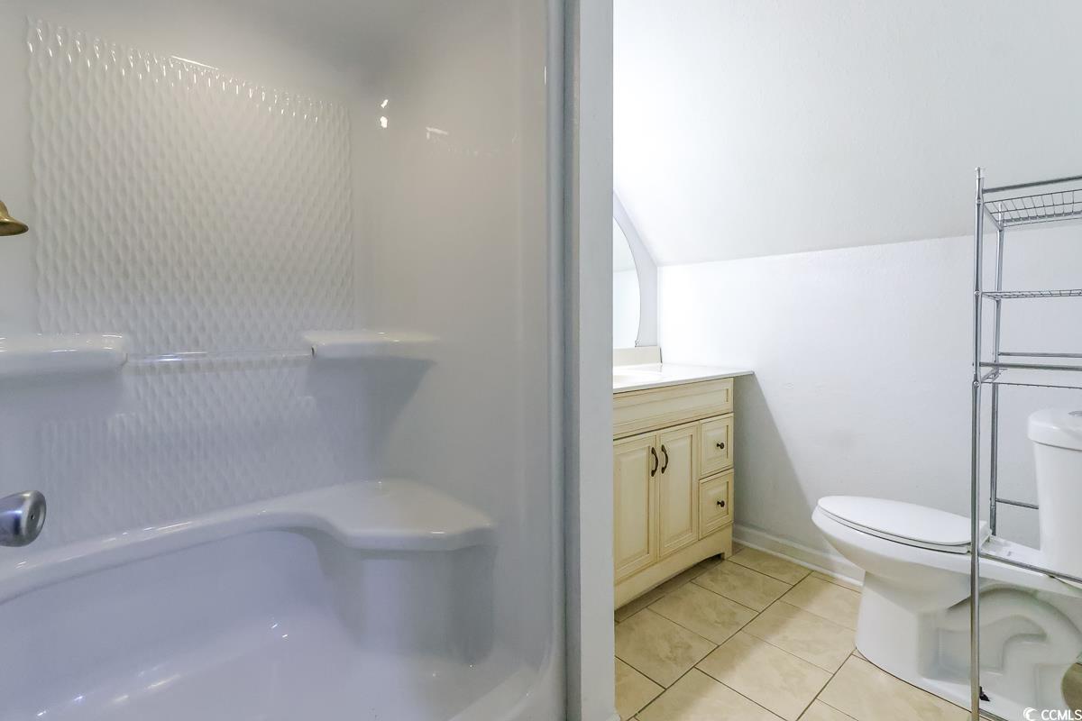 2191 Jasmine Road Loris, SC 29569 - Photo 33 of 40 Bathroom featuring toilet, tile patterned floors, vanity, and a shower