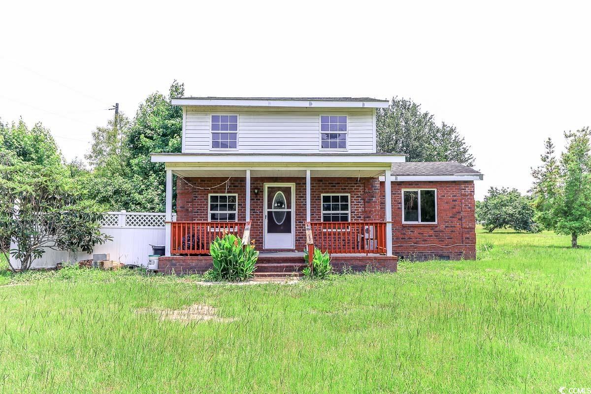 2191 Jasmine Road Loris, SC 29569 - Photo 37 of 40 Traditional-style home featuring brick siding and a porch
