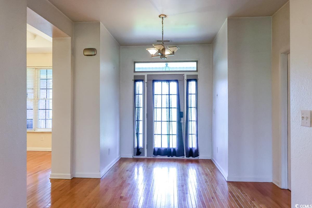 2191 Jasmine Road Loris, SC 29569 - Photo 4 of 40 Foyer featuring plenty of natural light, wood finished floors, and baseboards