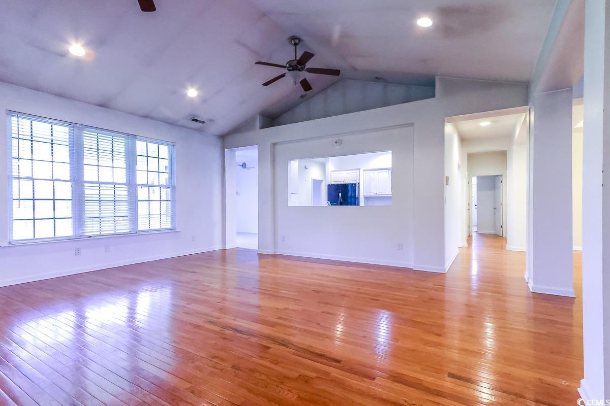 2191 Jasmine Road Loris, SC 29569 - Photo 7 of 40 Unfurnished living room featuring a ceiling fan, light wood finished floors, lofted ceiling, baseboards, and recessed lighting