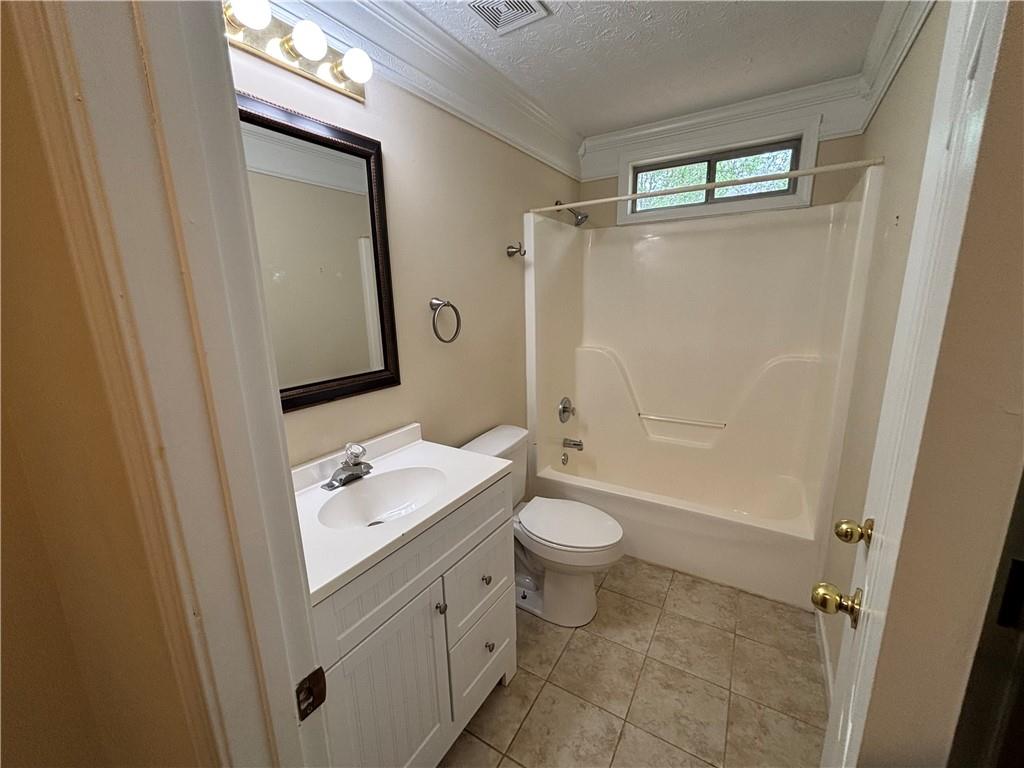 170 Gibson Way Covington, GA 30016 - Photo 12 of 50 a bathroom with a sink a toilet and shower