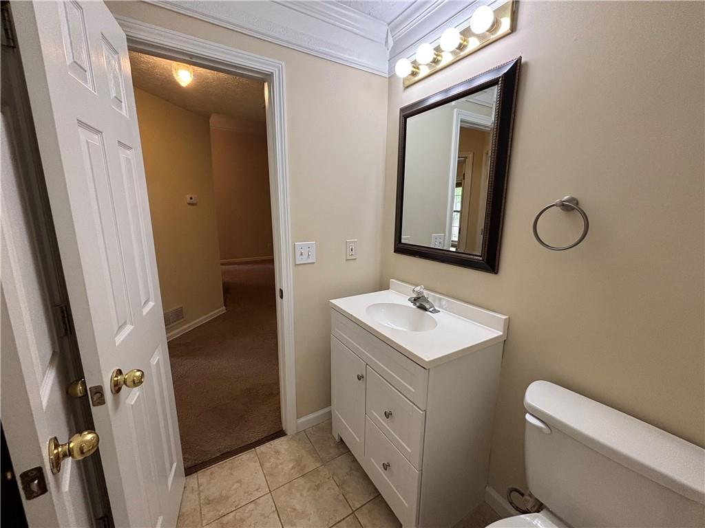 170 Gibson Way Covington, GA 30016 - Photo 13 of 50 a bathroom with a sink a toilet and a mirror