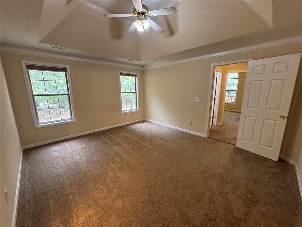 170 Gibson Way Covington, GA 30016 - Photo 16 of 50 an empty room with windows and entrance