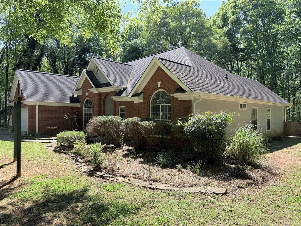 170 Gibson Way Covington, GA 30016 - Photo 2 of 50 a house view with a garden space