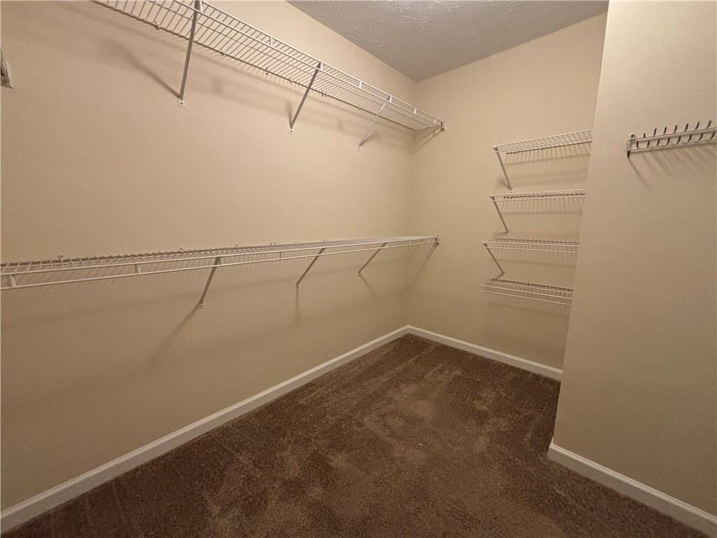 170 Gibson Way Covington, GA 30016 - Photo 21 of 50 a view of a room with racks on the wall