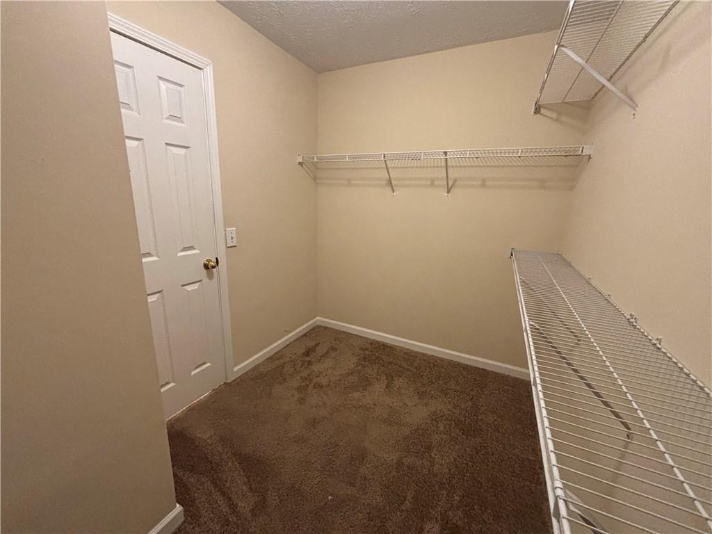 170 Gibson Way Covington, GA 30016 - Photo 22 of 50 a view of a room with racks on the wall