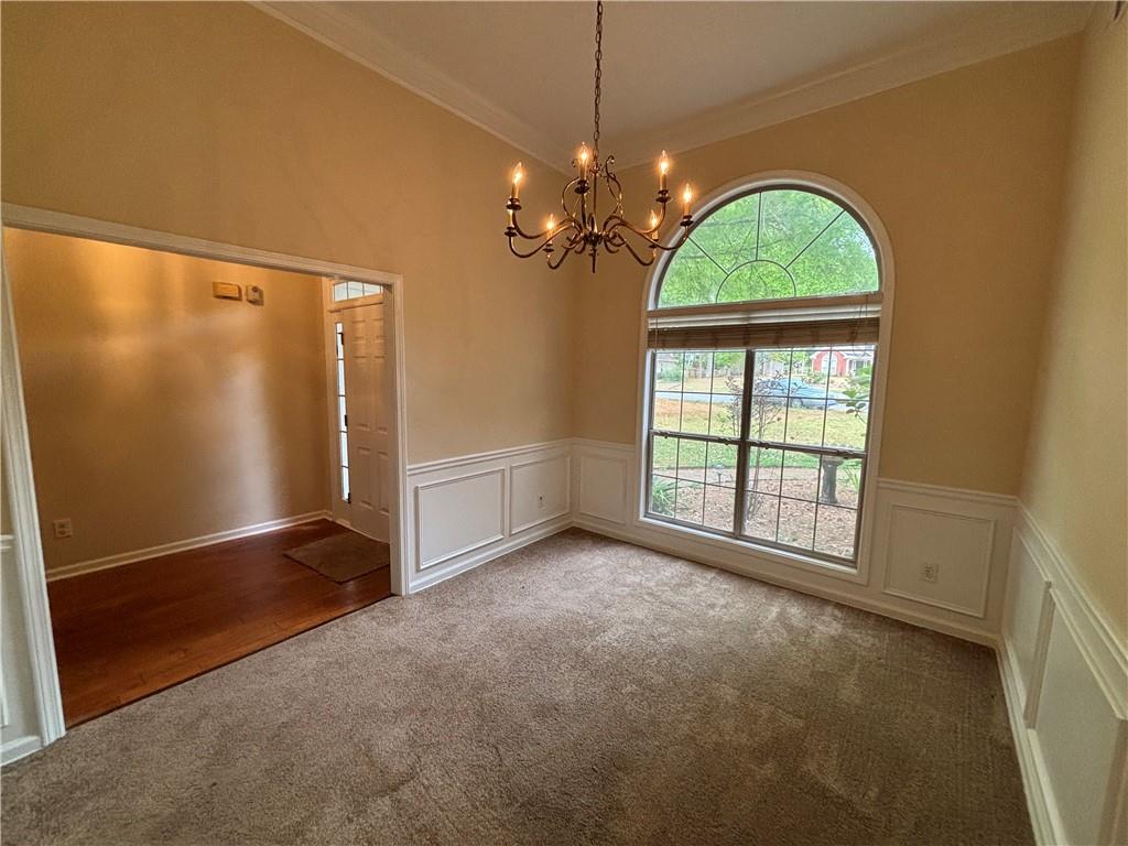170 Gibson Way Covington, GA 30016 - Photo 26 of 50 an empty room with windows and entryway