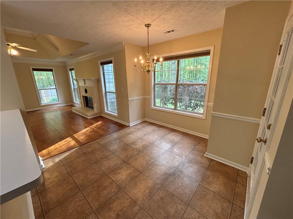170 Gibson Way Covington, GA 30016 - Photo 30 of 50 a view of an empty room with window and chandelier