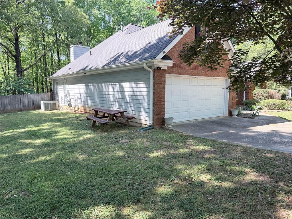 170 Gibson Way Covington, GA 30016 - Photo 3 of 50 a backyard of a house with a table and chairs