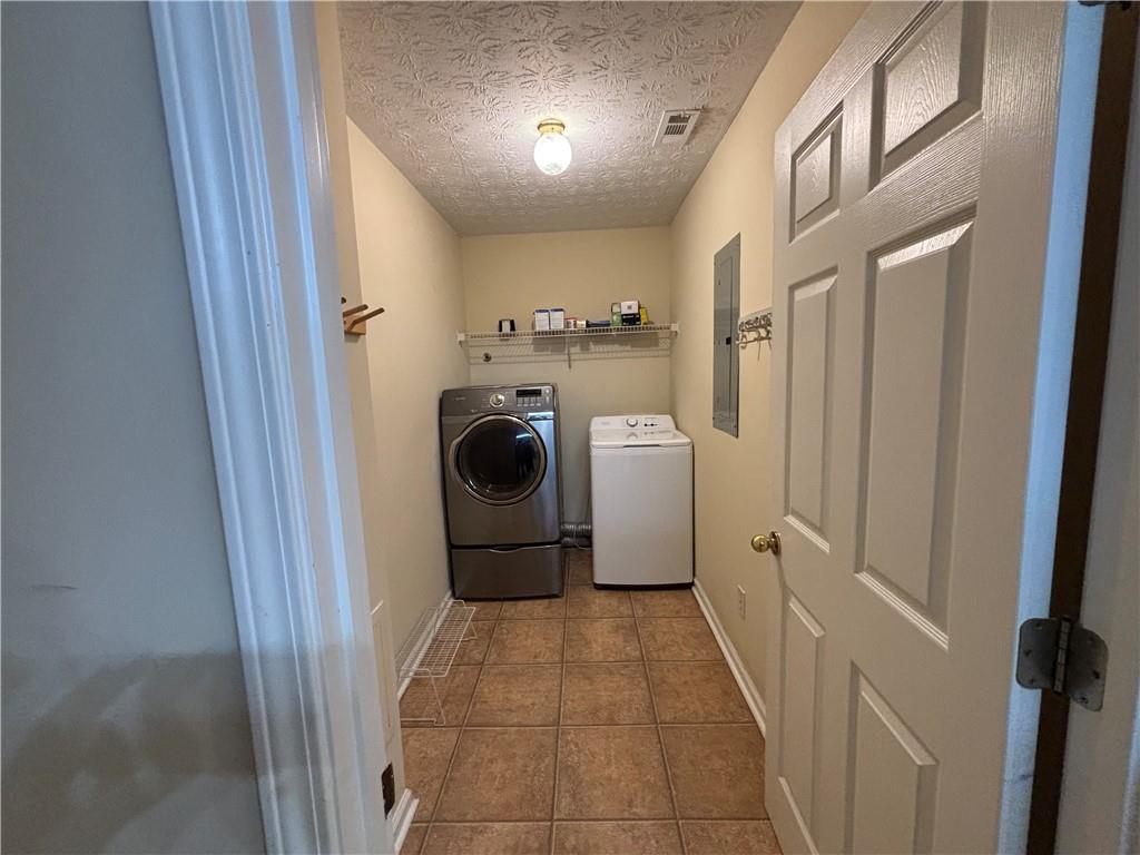 170 Gibson Way Covington, GA 30016 - Photo 36 of 50 a utility room with dryer and washer