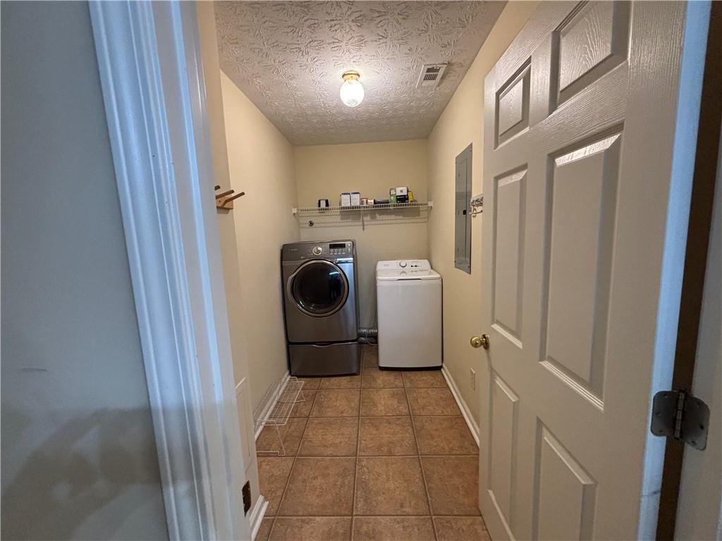 170 Gibson Way Covington, GA 30016 - Photo 37 of 50 a utility room with dryer and washer
