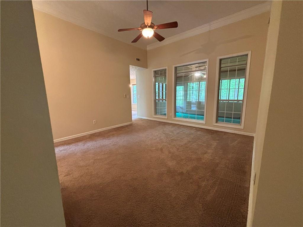 170 Gibson Way Covington, GA 30016 - Photo 5 of 50 a view of an empty room with a window