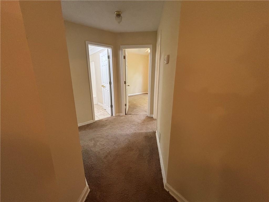 170 Gibson Way Covington, GA 30016 - Photo 6 of 50 a view of a hallway with wooden shelves