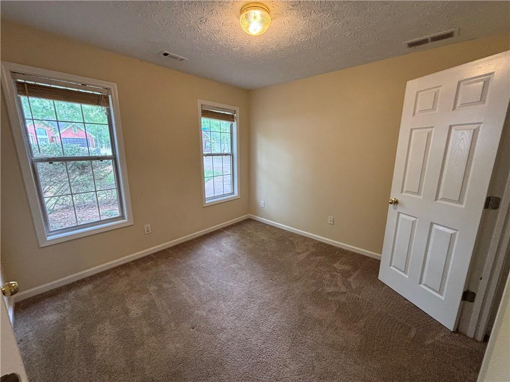 170 Gibson Way Covington, GA 30016 - Photo 8 of 50 a view of an empty room with a window