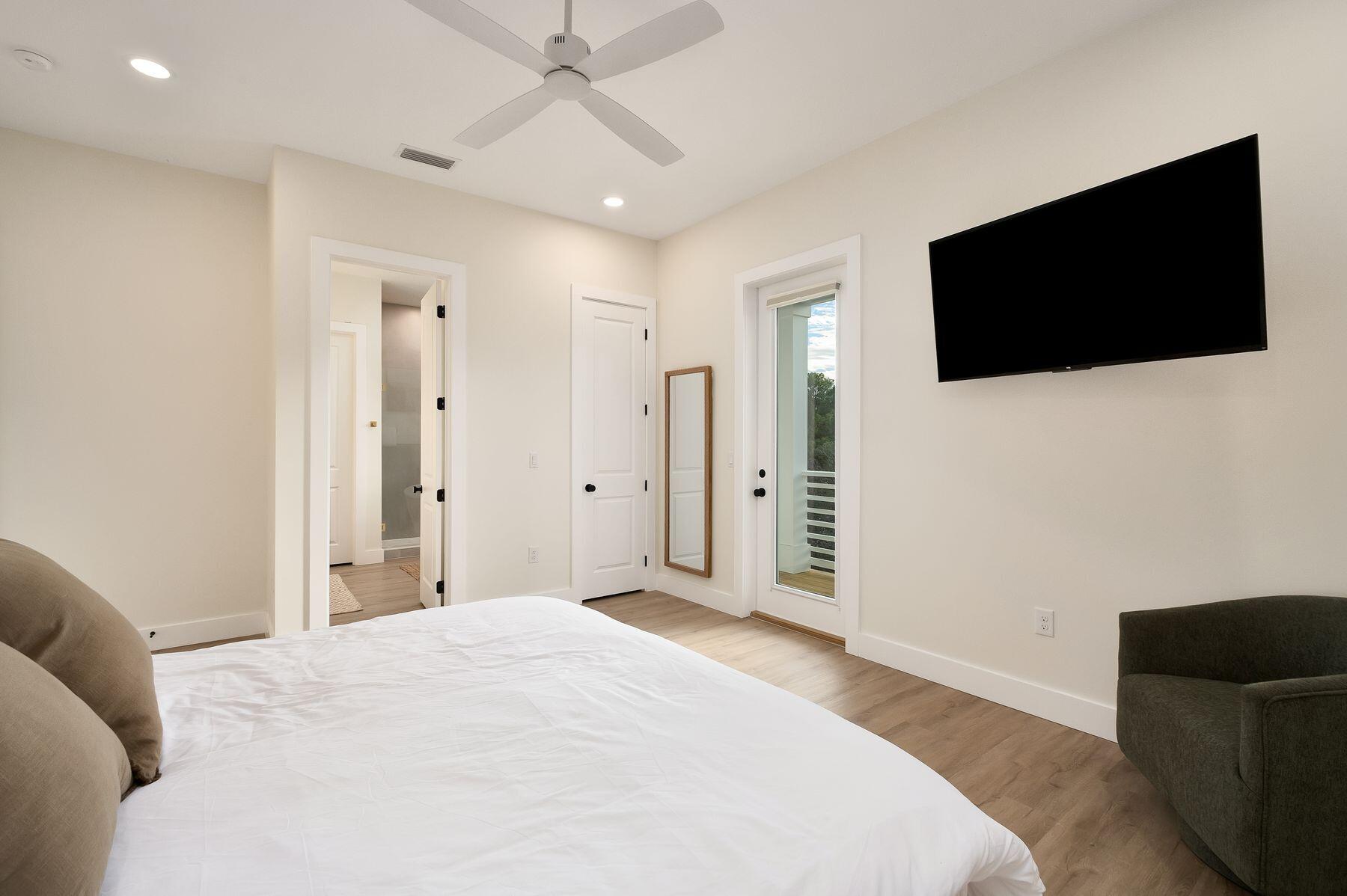 221 Hillcrest Road Santa Rosa Beach, FL 32459 - Photo 21 of 52 a bedroom with a bed and a flat screen tv