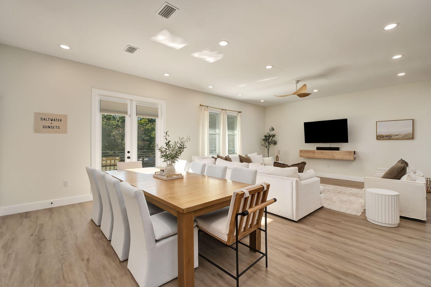 221 Hillcrest Road Santa Rosa Beach, FL 32459 - Photo 9 of 52 a view of a dining room with furniture and wooden floor