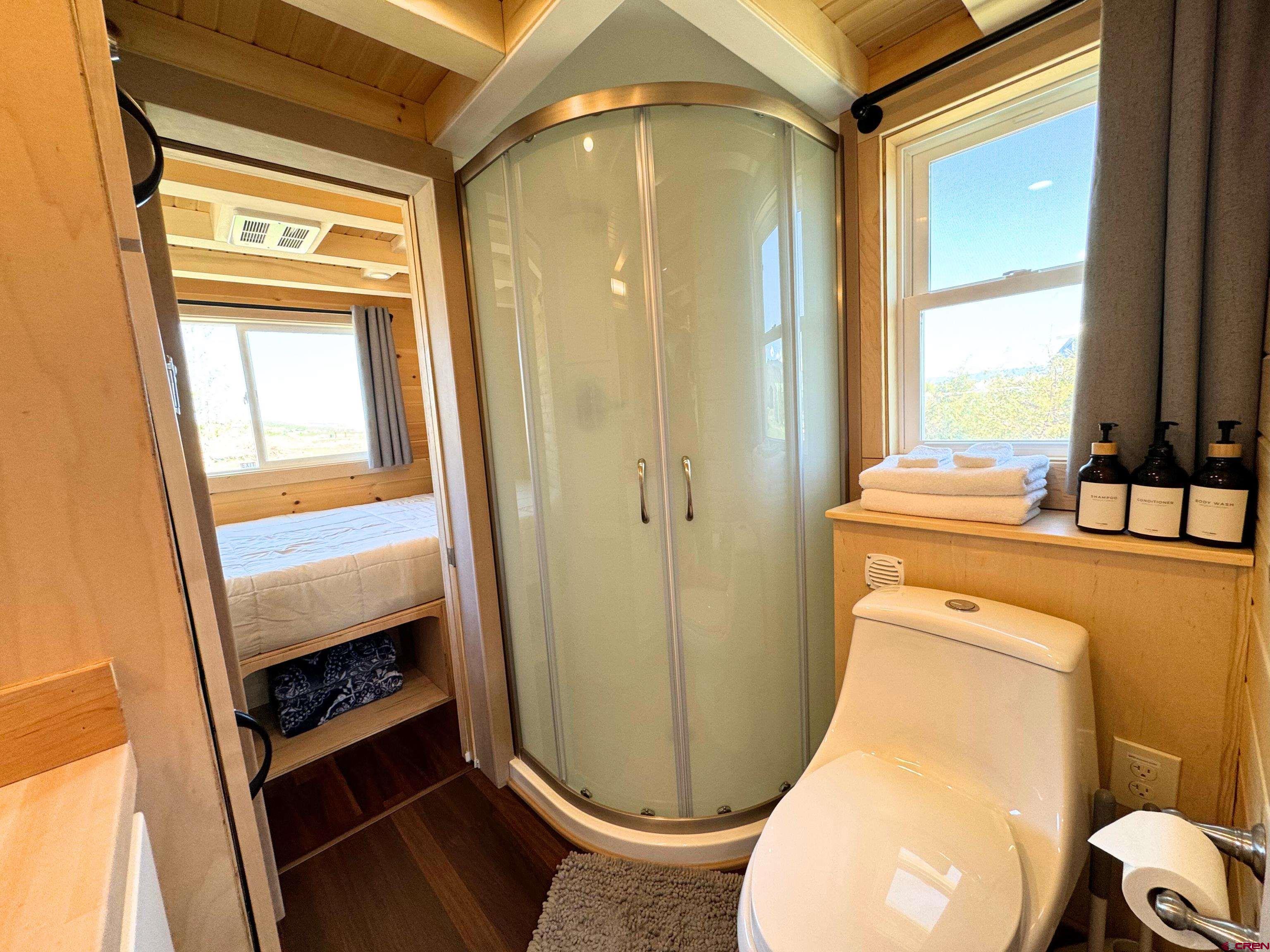 22130 6850 Road, Unit 210215 Montrose, CO 81403 - Photo 29 of 35 a bathroom with a sink and a mirror