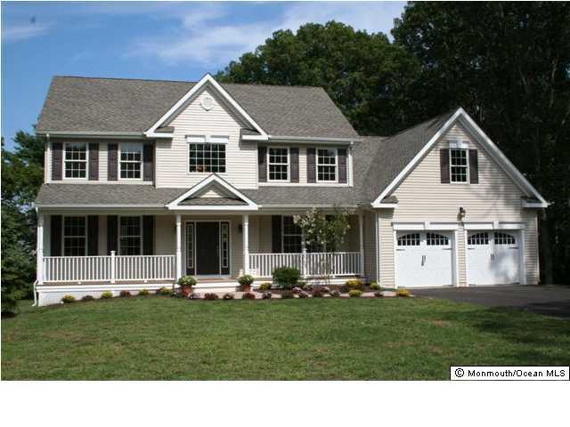 3245 Ridgewood Road Allenwood, NJ 08720 - Photo 1 of 3 a front view of a house with a yard