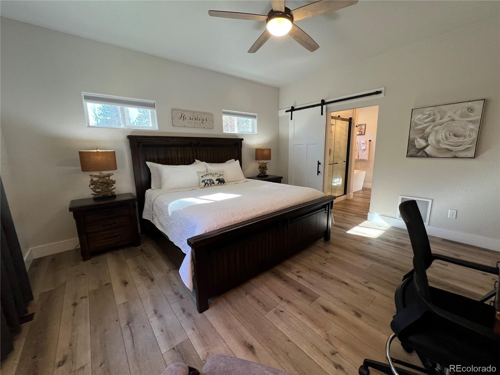 348 Duesouth Road Florissant, CO 80816 - Photo 13 of 28 a bedroom with bed and window