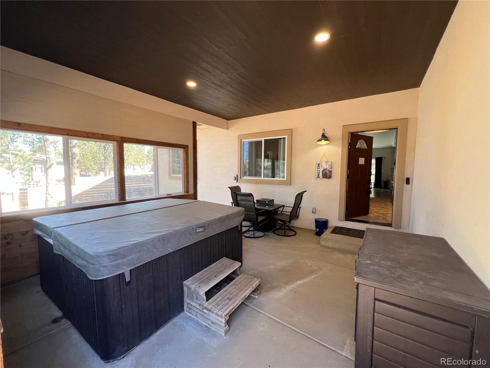 348 Duesouth Road Florissant, CO 80816 - Photo 2 of 28 a spacious bathroom with a granite countertop sink and a large mirror