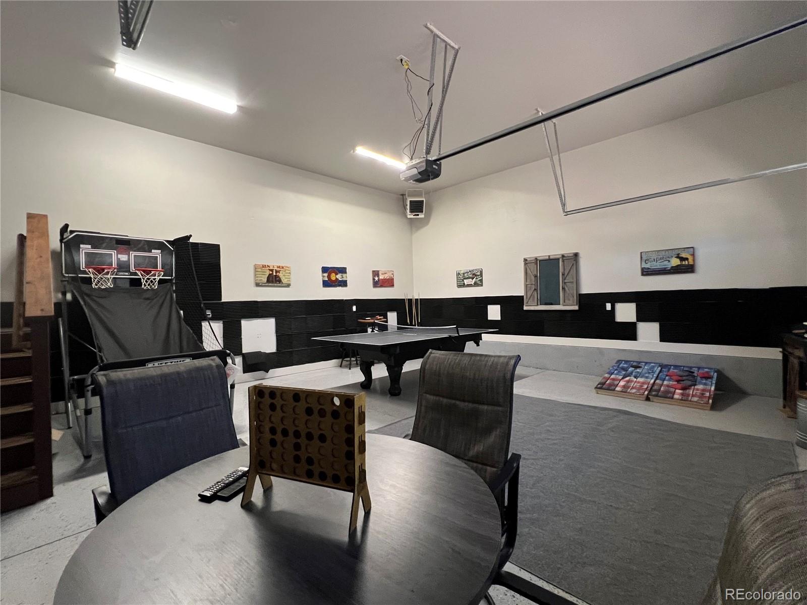 348 Duesouth Road Florissant, CO 80816 - Photo 26 of 28 a living room with lots of furniture and clutter