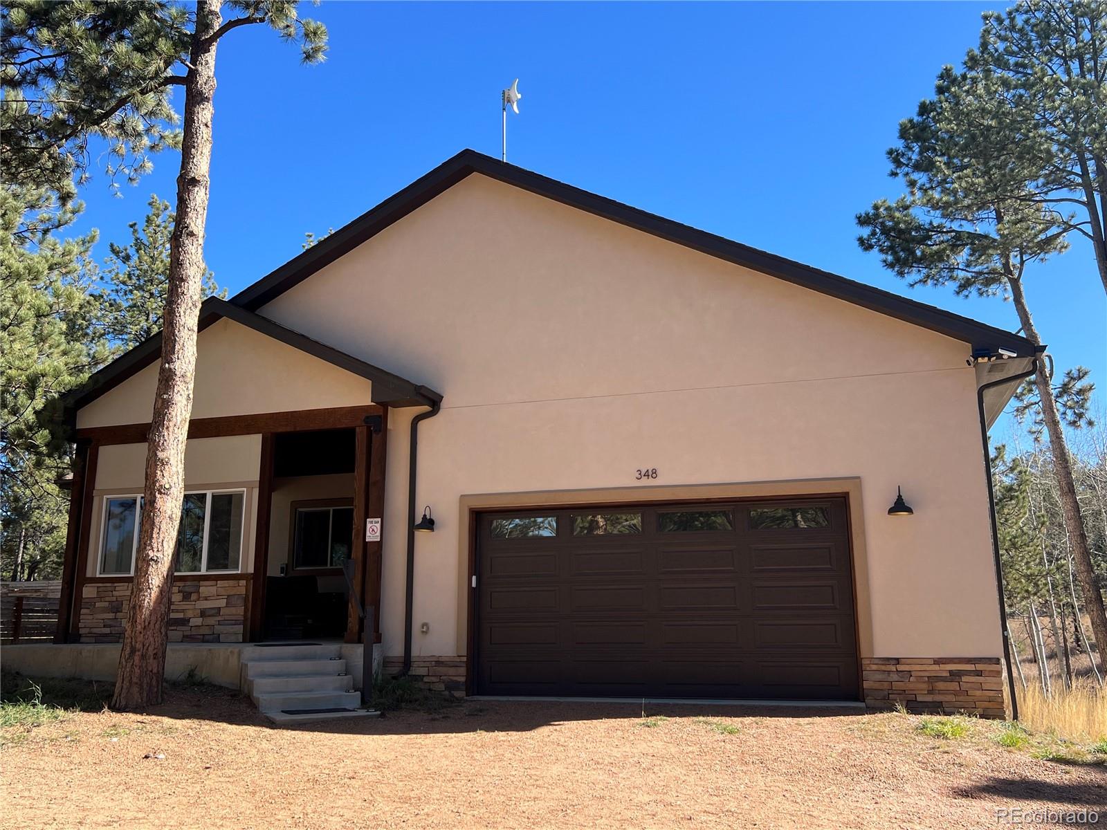 348 Duesouth Road Florissant, CO 80816 - Photo 28 of 28 a view of a house with wooden fence and windows