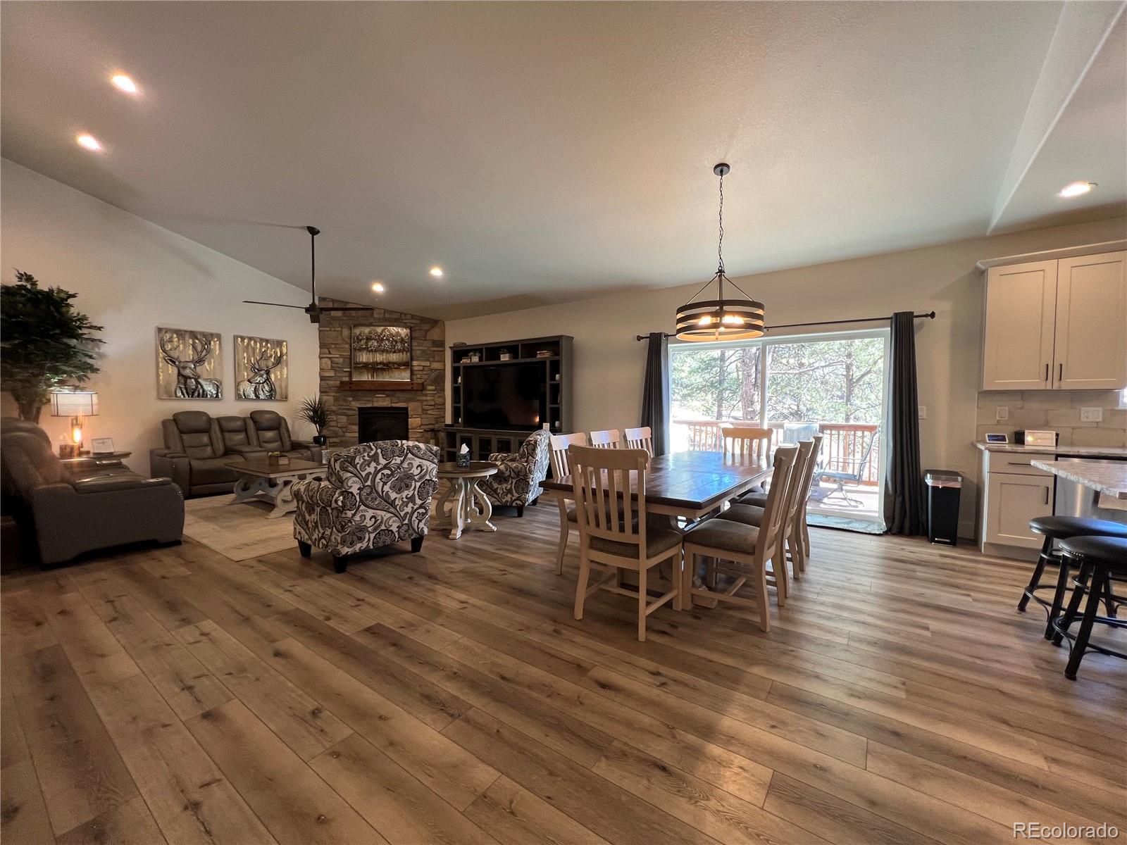 348 Duesouth Road Florissant, CO 80816 - Photo 4 of 28 a living room with furniture and a chandelier