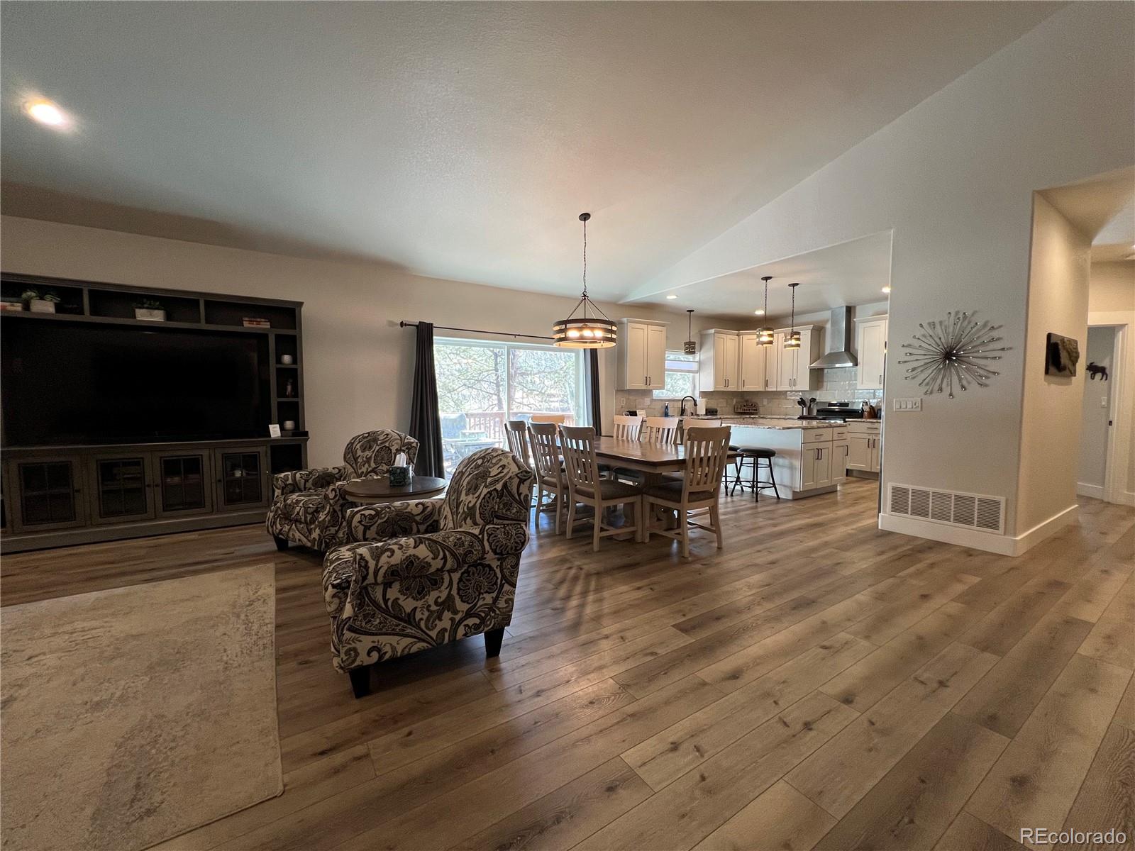 348 Duesouth Road Florissant, CO 80816 - Photo 7 of 28 a living room with furniture and a flat screen tv