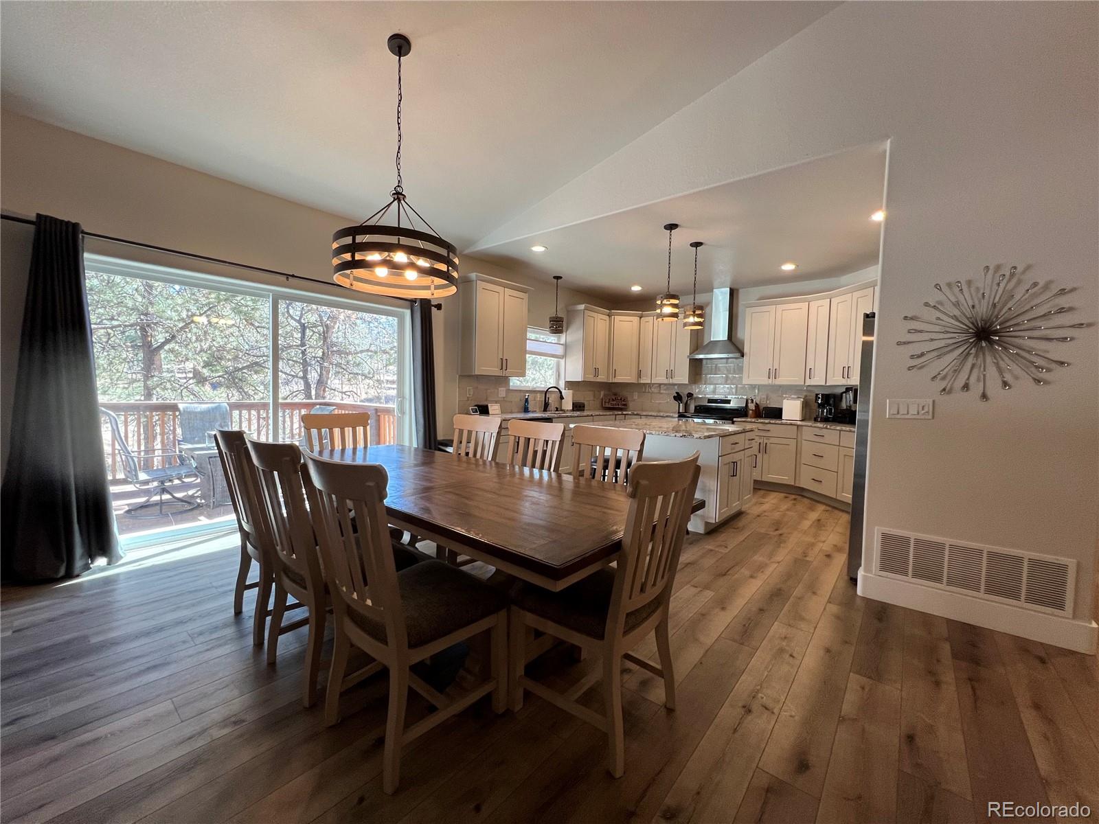 348 Duesouth Road Florissant, CO 80816 - Photo 9 of 28 a view of a dining room with furniture window and wooden floor