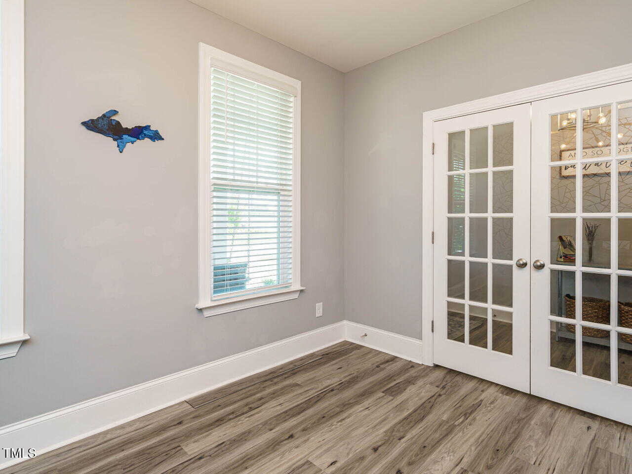 2909 Thurman Dairy Loop Wake Forest, NC 27587 - Photo 18 of 46 a view of an empty room with a window and wooden floor