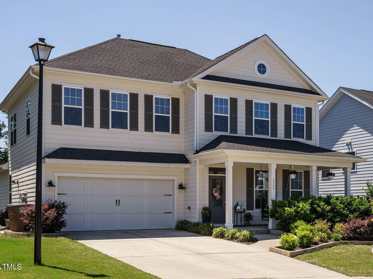 2909 Thurman Dairy Loop Wake Forest, NC 27587 - Photo 2 of 46 a front view of a house with garden