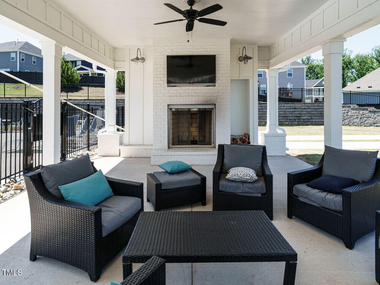 2909 Thurman Dairy Loop Wake Forest, NC 27587 - Photo 41 of 46 a living room with furniture a flat screen tv and a fireplace