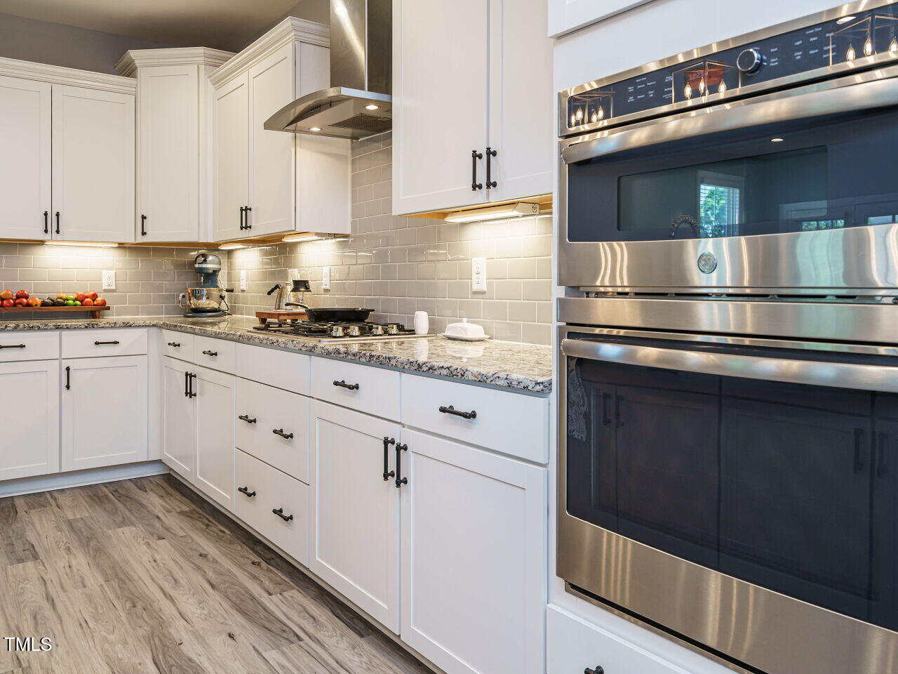 2909 Thurman Dairy Loop Wake Forest, NC 27587 - Photo 8 of 46 a kitchen with granite countertop a stove and cabinets