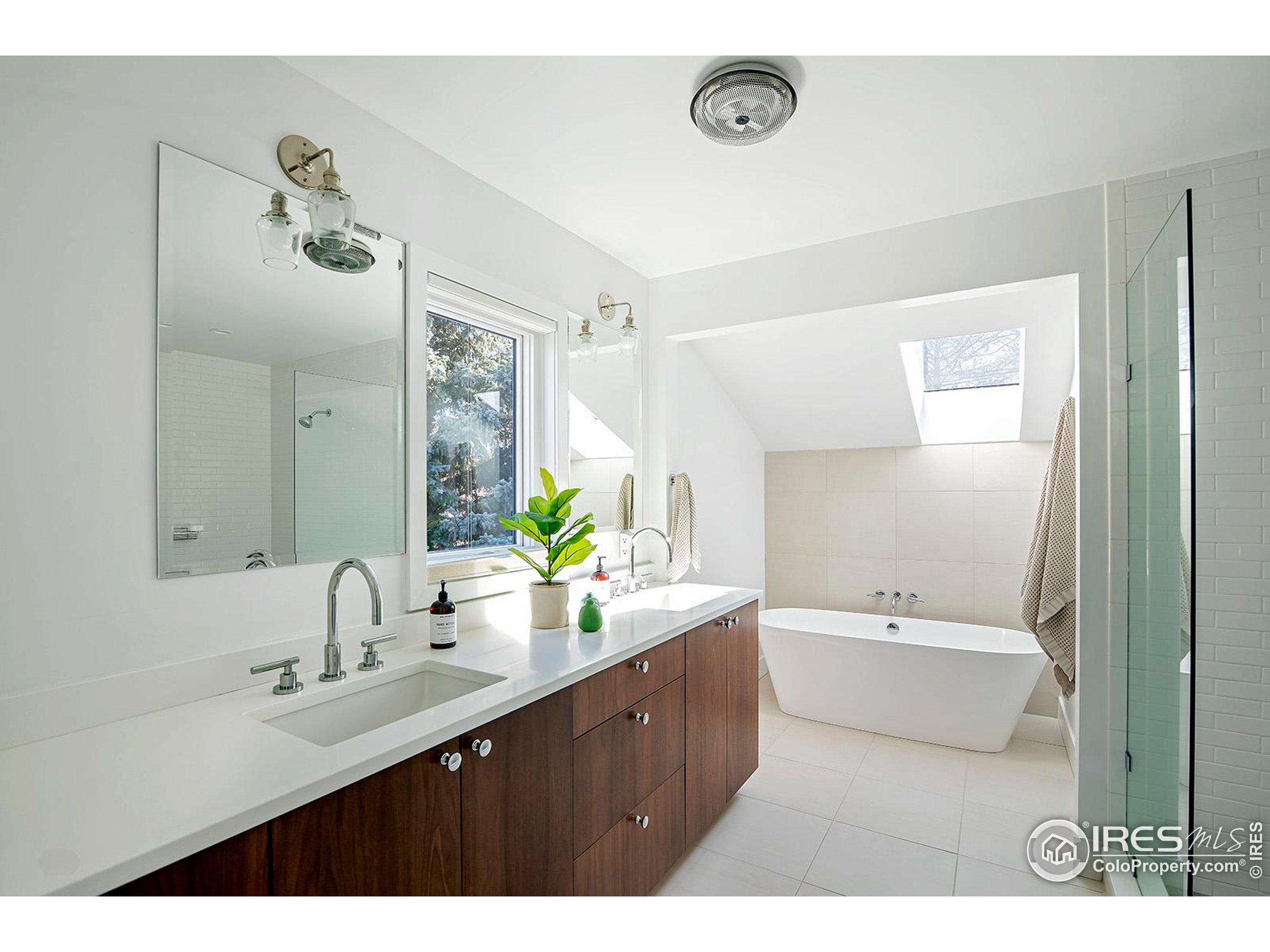 1707 Grape Avenue Boulder, CO 80304 - Photo 17 of 35 a bathroom with a double vanity sink and a mirror