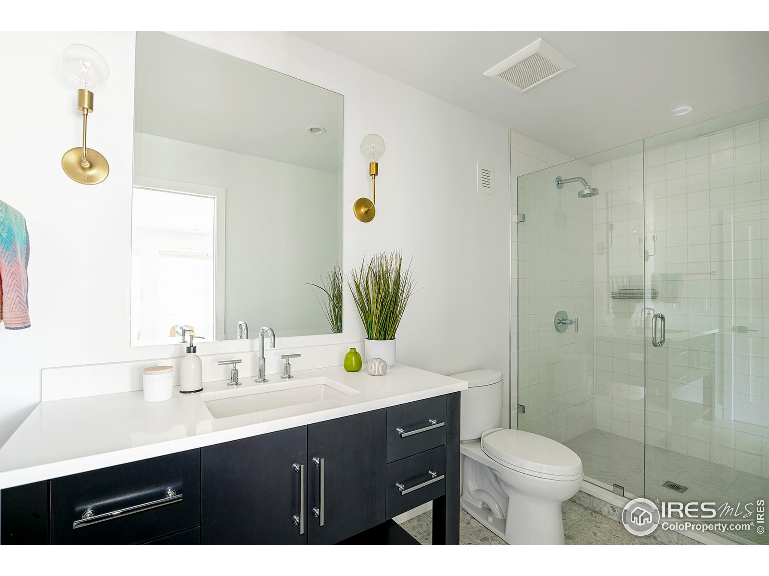 1707 Grape Avenue Boulder, CO 80304 - Photo 31 of 35 a bathroom with a sink a toilet and shower