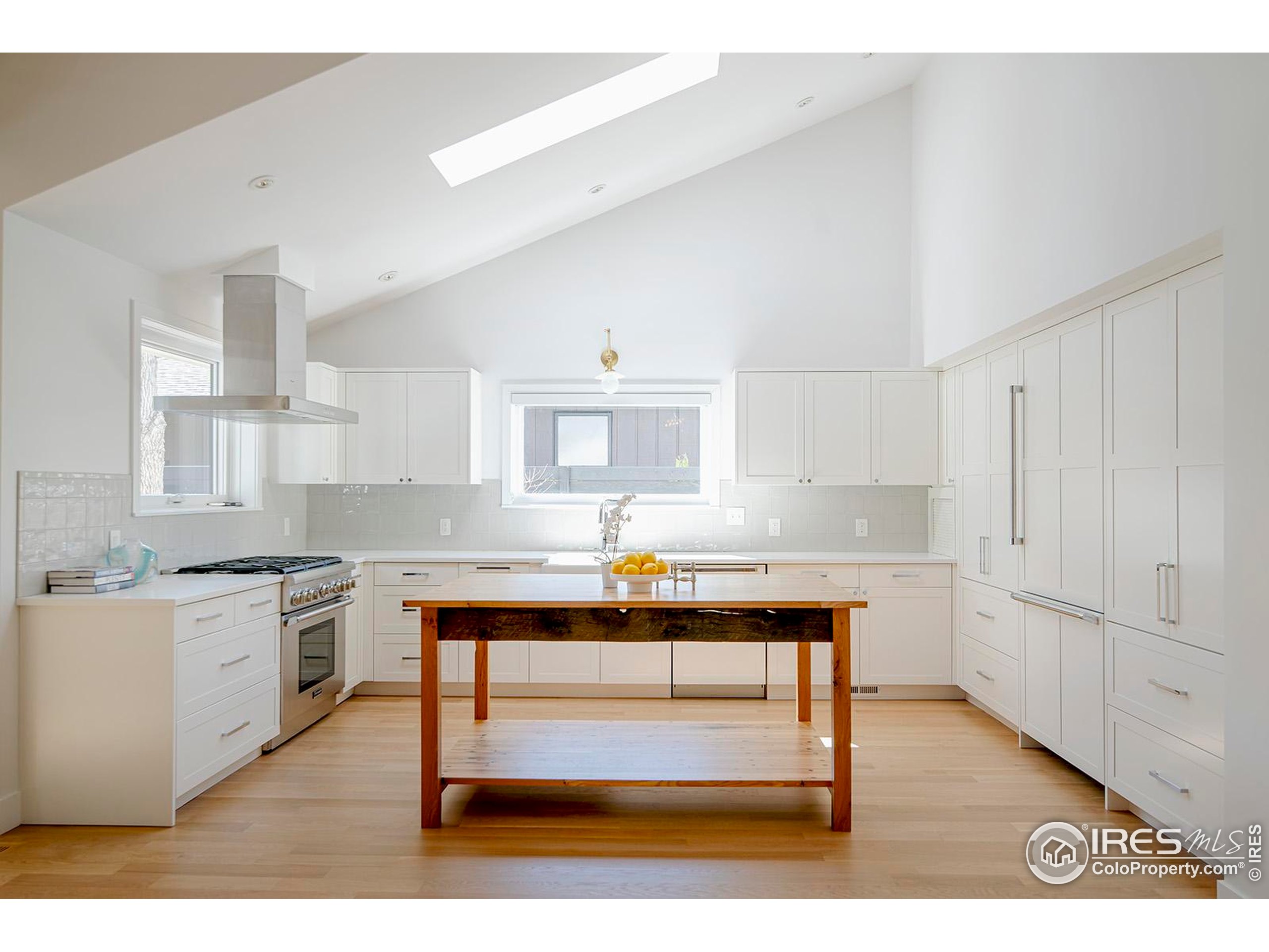 1707 Grape Avenue Boulder, CO 80304 - Photo 9 of 35 a kitchen with cabinets and wooden floor