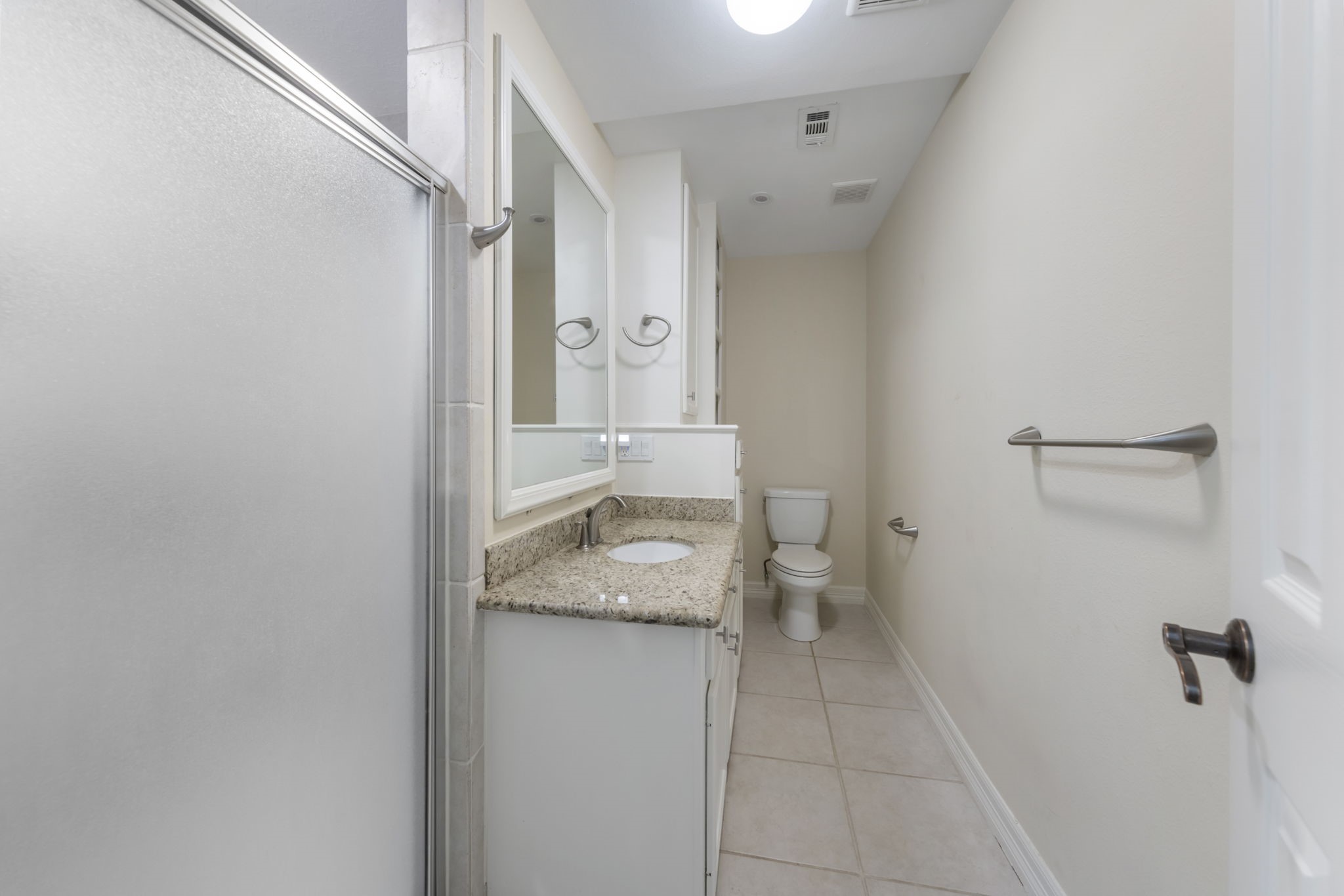 90 West Horizon Ridge Place Spring, TX 77381 - Photo 29 of 36 a bathroom with a granite countertop sink toilet and shower