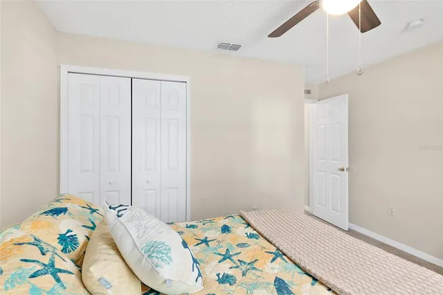 a bedroom with a bed and a table in it