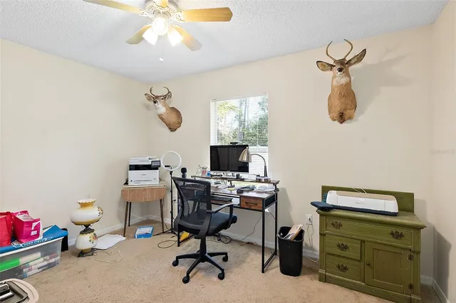 a view of a workspace with furniture