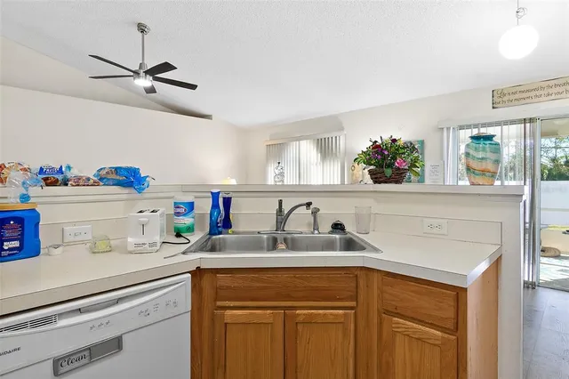 a kitchen with sink cabinets and window