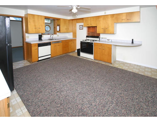 355 Water Street Springfield, MA 01151 - Photo 10 of 16 a large kitchen with cabinets and stainless steel appliances
