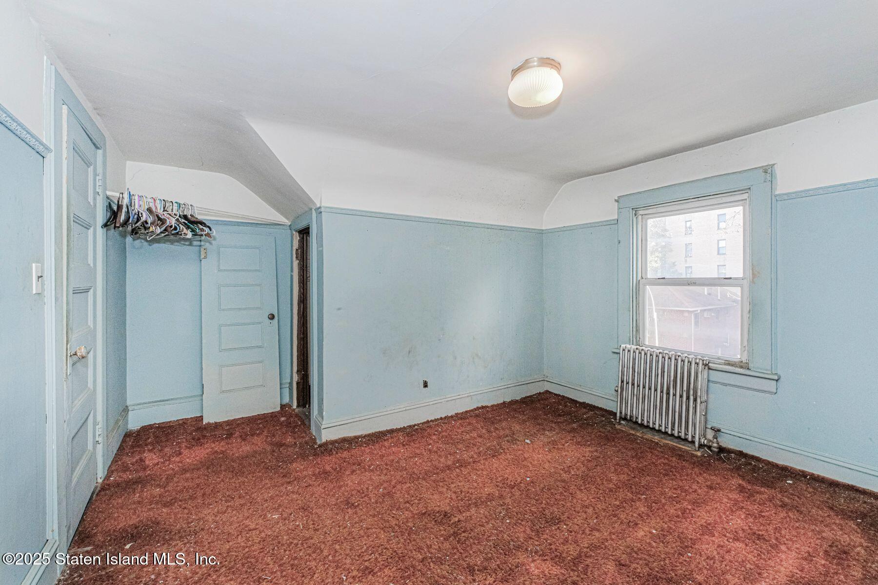 316 Sherman Street Brooklyn, NY 11218 - Photo 13 of 26 an empty room with windows