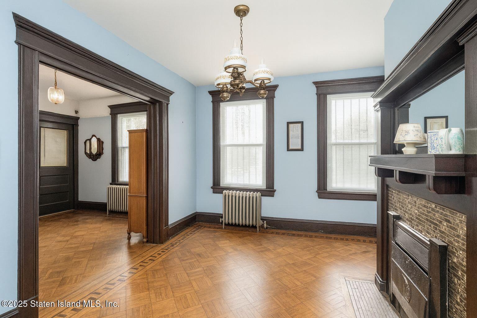 316 Sherman Street Brooklyn, NY 11218 - Photo 15 of 26 a view of livingroom with hardwood floor and a ceiling fan