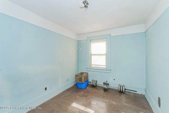 a view of a room with furniture and windows