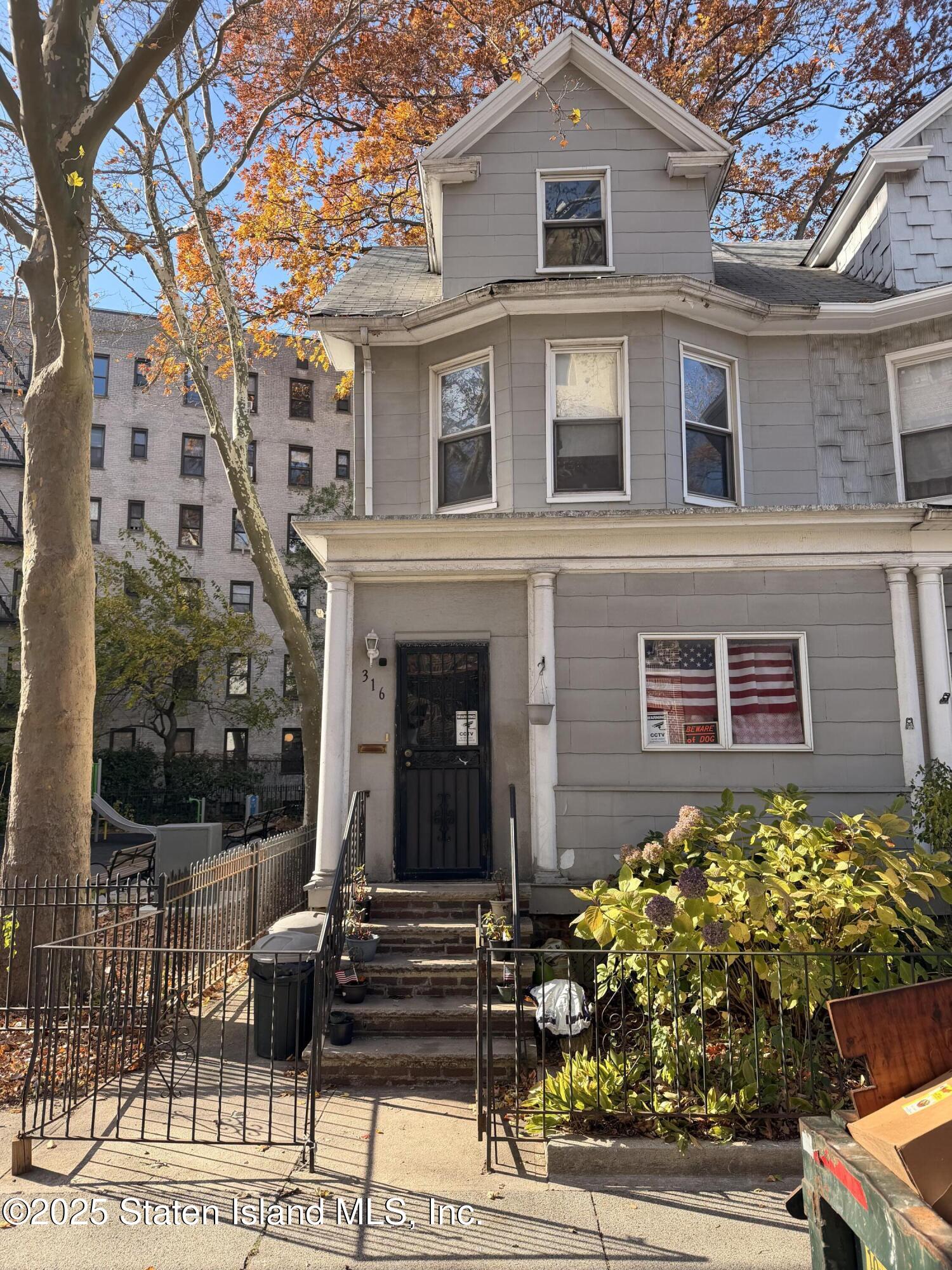 316 Sherman Street Brooklyn, NY 11218 - Photo 5 of 26 a view of a brick house with windows